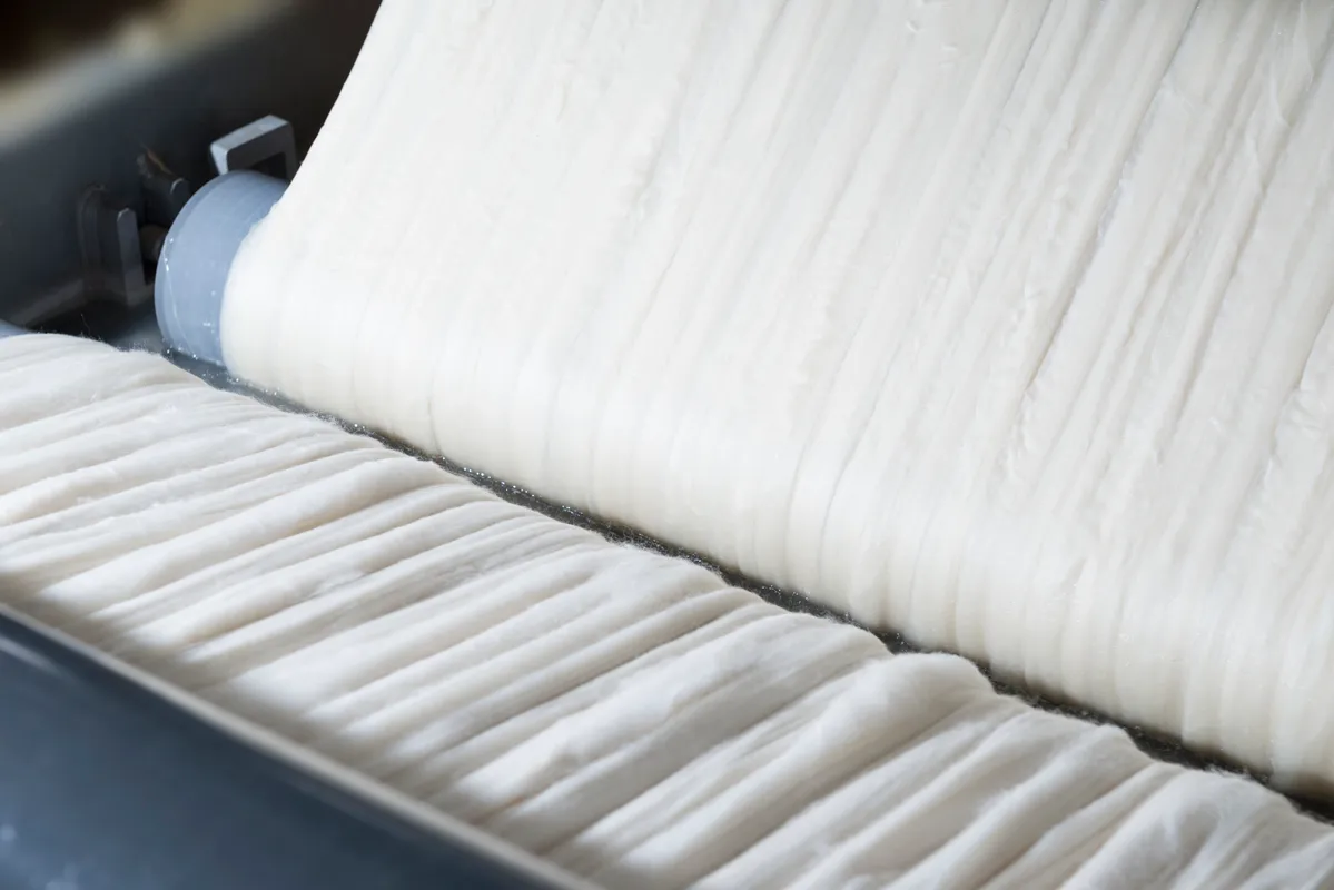 Superwash wool tops on the processing line